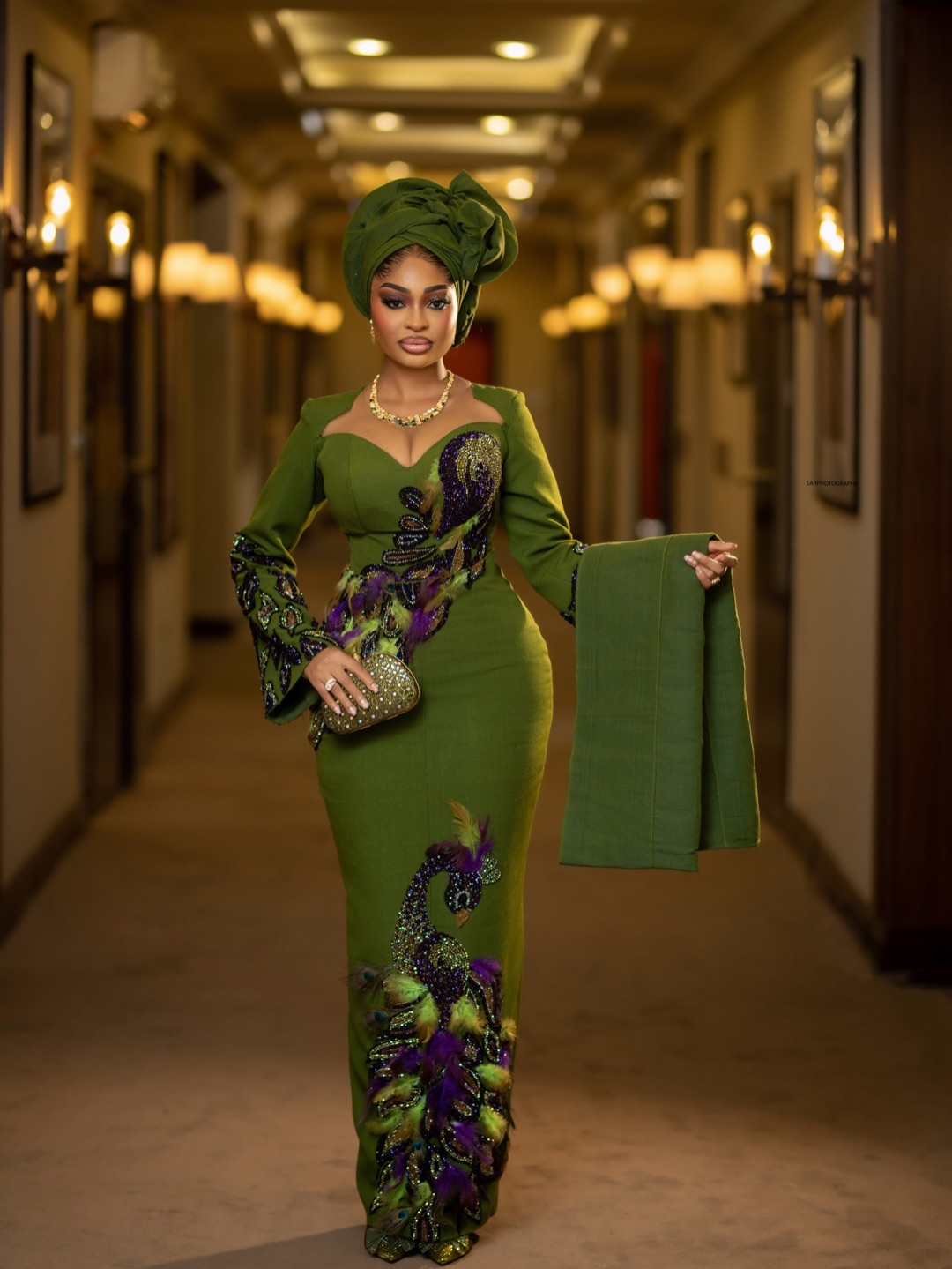 Green and purple embroidered outfit used in an illustrative style preview